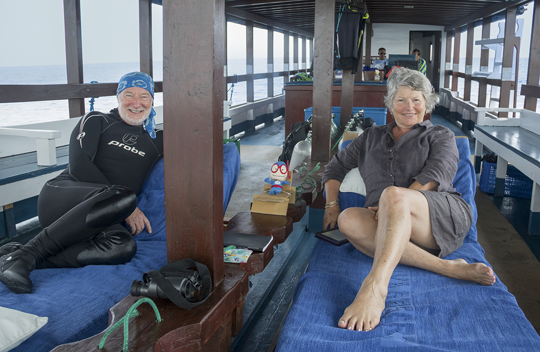 Wade and Robin Hughes relaxing between dives on one of Wakatobi's private dive boats.