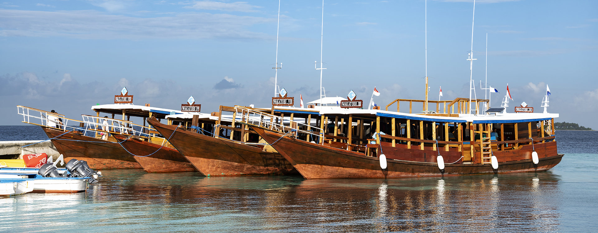 Four of Wakatobi's dive boats lined on the resort's jetty.