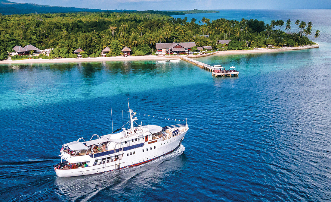 Pelagian dive yacht out front of Wakatobi Dive Resort.