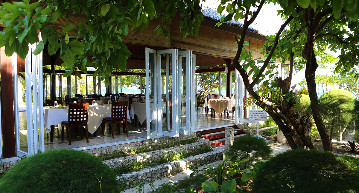 Each day you have a choice of a table inside the open-air, thatch-roof dining hall or seating on the outdoor terraces that flank Wakatobi's restaurant.