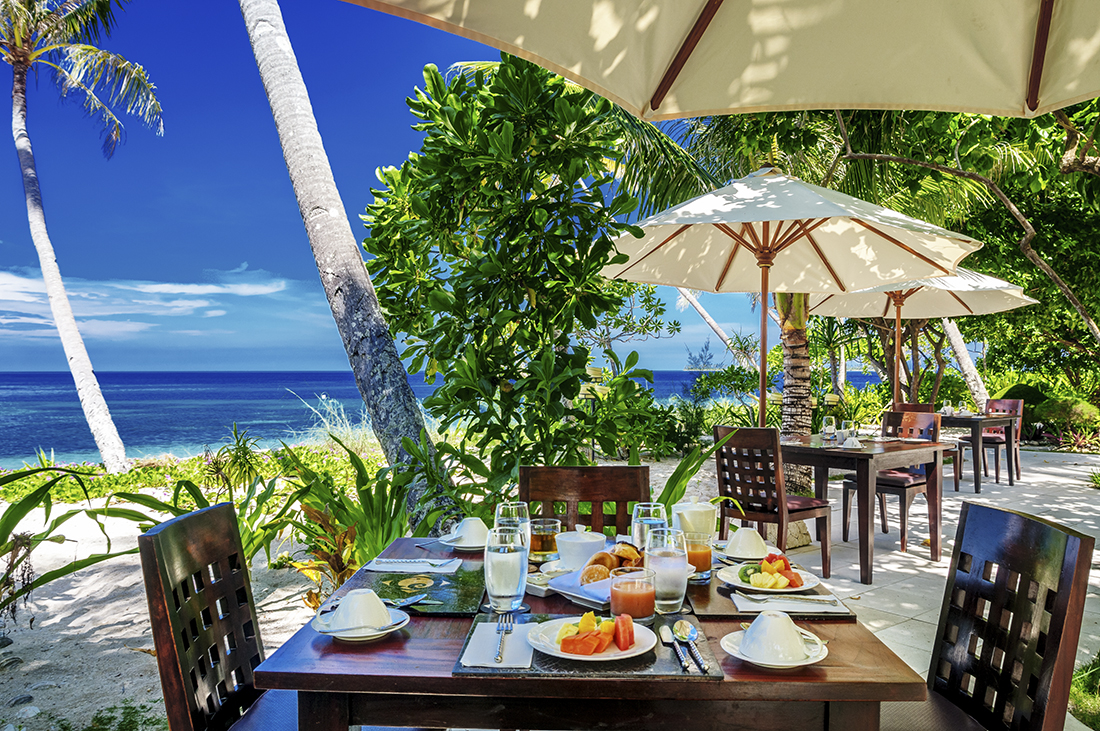 Out side on the patio deck with ocean view at Wakatobi's Restaurant.