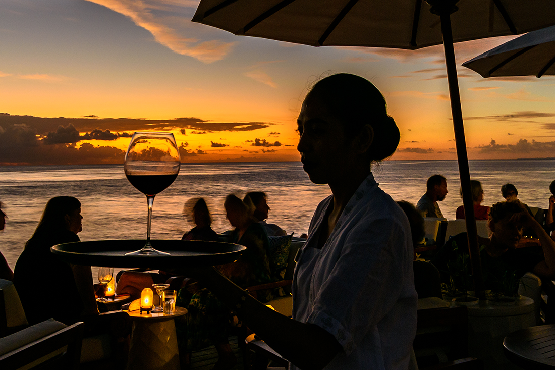 Service at sunset on the Wakatobi Jetty Bar.